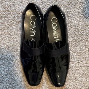 Calvin Klein Glossy Black Slip-On Loafers